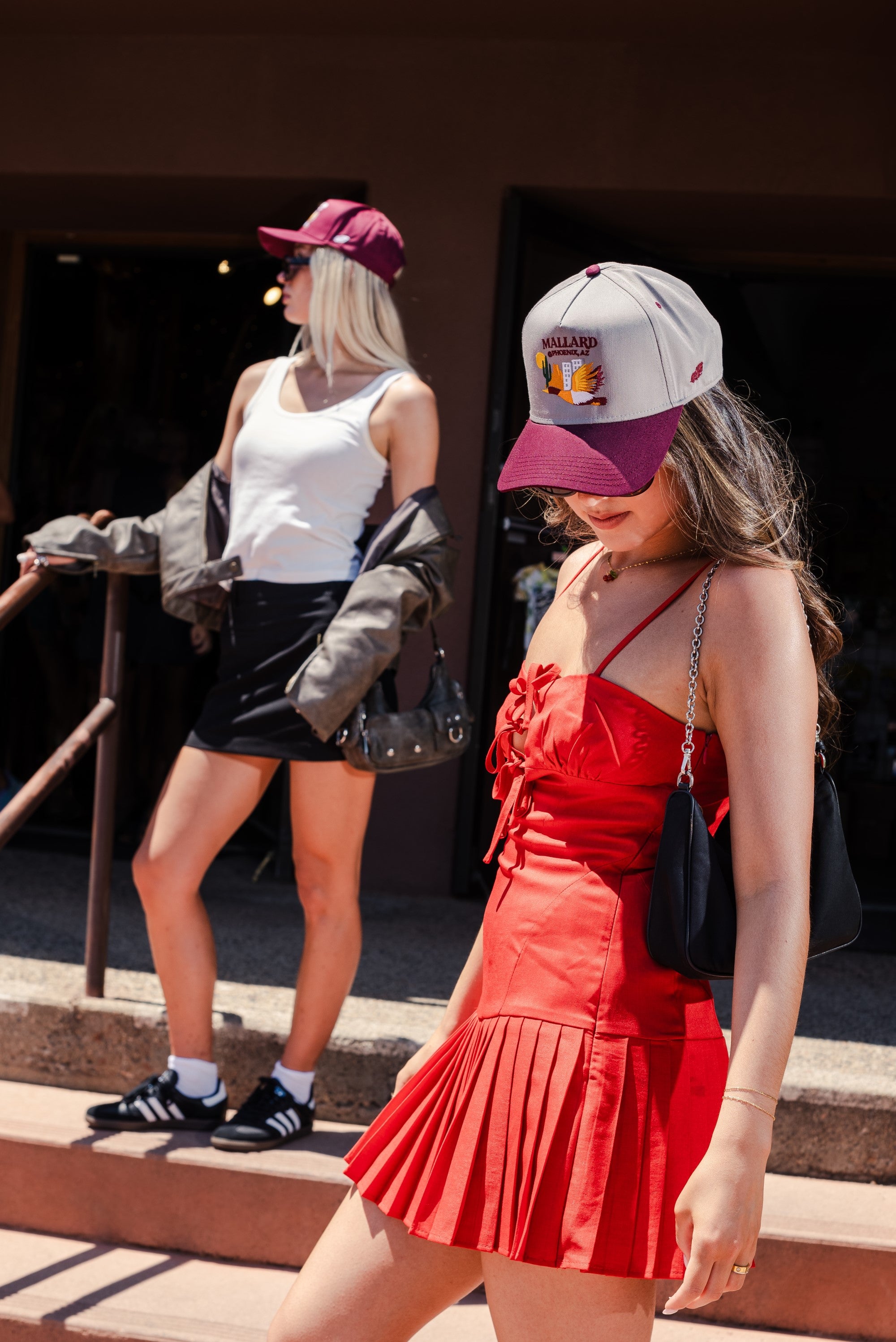 Two women posing with Mallard and Friends Hats featuring Phoenix, AZ Drop mobile version